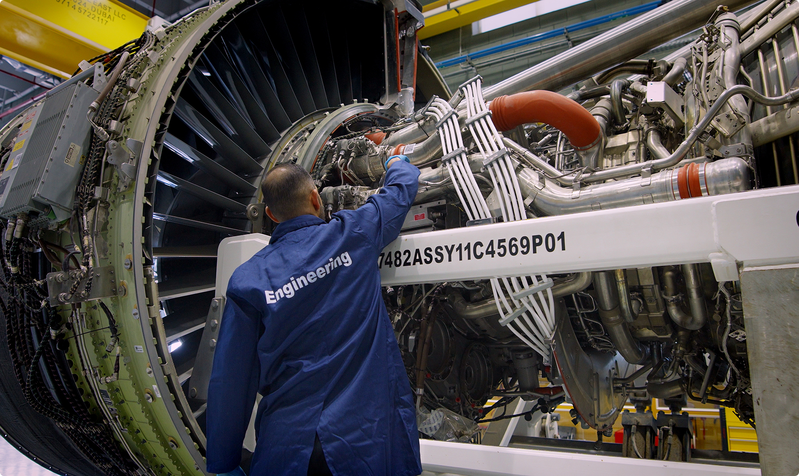 Engineer inspecting an aircraft engine