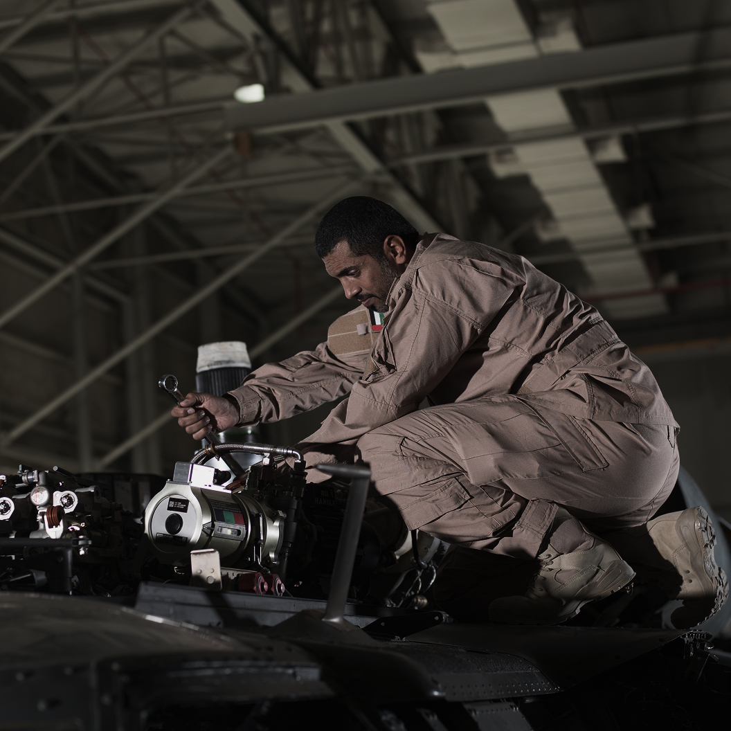 Technician maintaining an engine